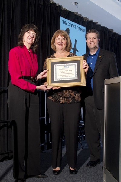 Cathy Schultz Accepts Commemorative Plaque from ISSAEF, which will now offer a scholarship in the honor of her deceased husband, Gene Schultz